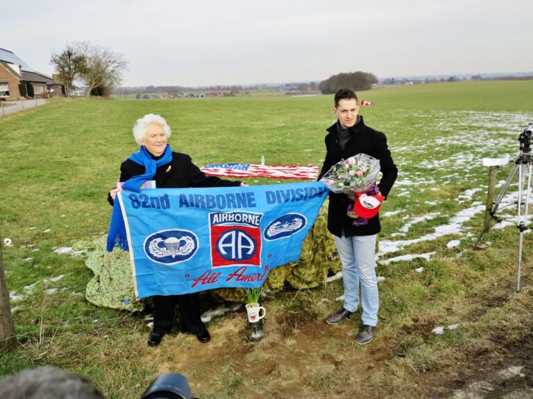 Netherlands Anna Hess and Maarten Vossen holding an 2nd airborne division Banner January 28th in groesbeek at the james e wickline memorial