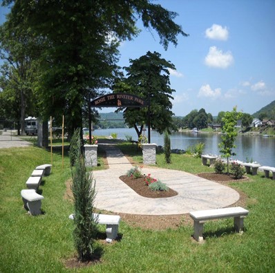 Park that Rosies planned and opened on Memorial Day, 2012 in St. Albans, WV.  The oval represents democracy. The dogwood tree is the first planted by Rosies and veterans from America and Europe.  Today, a monument is in the center.   